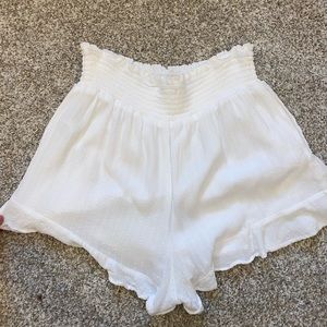 High waisted, white flow shorts.
